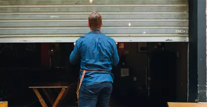 Man closing a shop